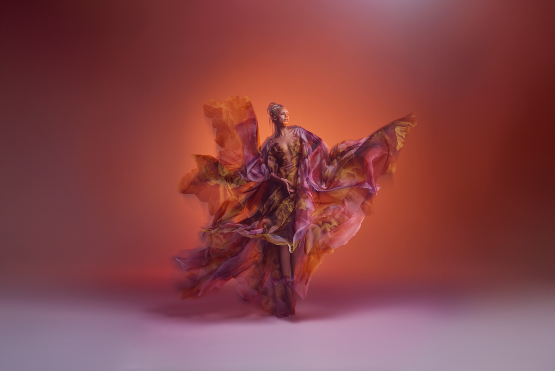 Iris van Herpen. Cosmica dress, Shift Souls collection, Haute Couture spring/summer 2019. Colored clouds by Kim Keever printed on translucent organza. Photo by Warren du Preez & Nick Thornton Jones Model: Jazzelle